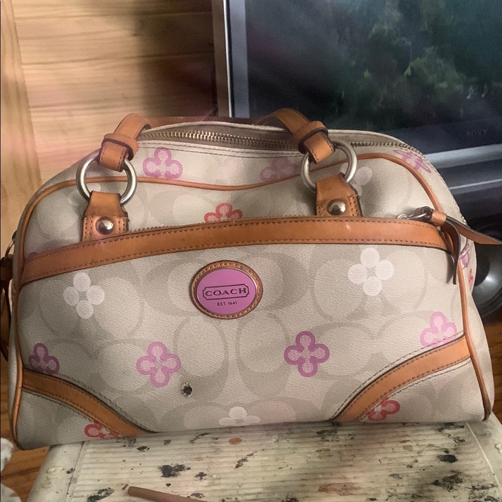Coach Cream and Pink Satchel with Silver Hardware

BURN HOLE ON FRONT OF BAG !!!